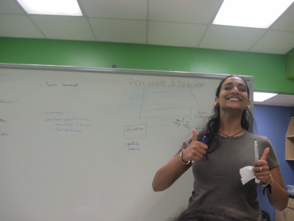 Tanvi at a whiteboard